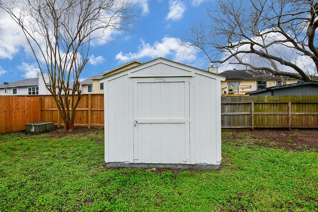 view of outdoor structure featuring a lawn