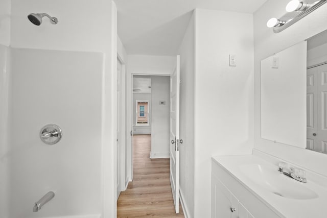 bathroom featuring vanity and wood-type flooring