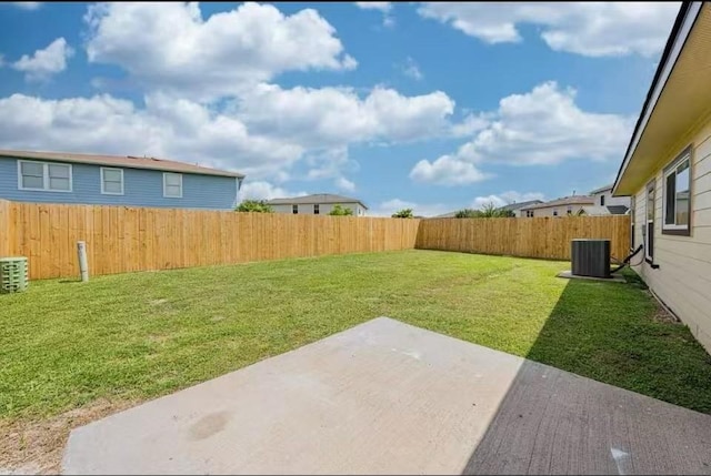 view of yard featuring cooling unit and a patio