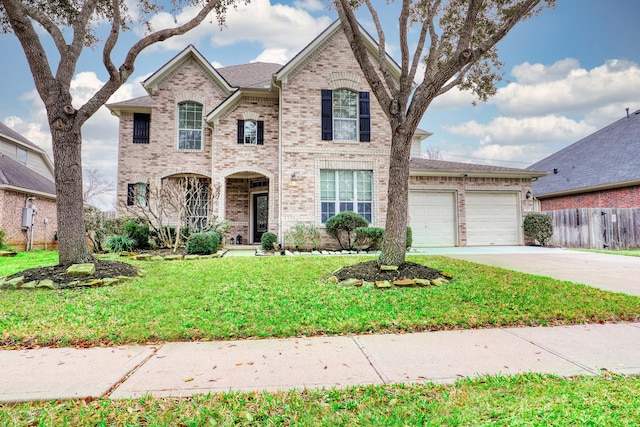 view of front of property with a garage and a front yard