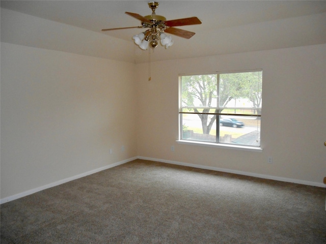 carpeted empty room with ceiling fan