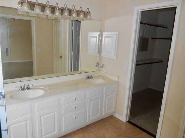 bathroom with tile patterned floors and vanity