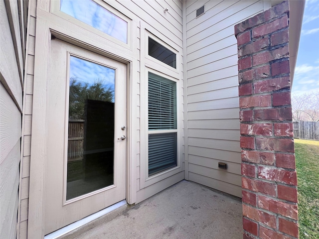 doorway to property featuring a patio area