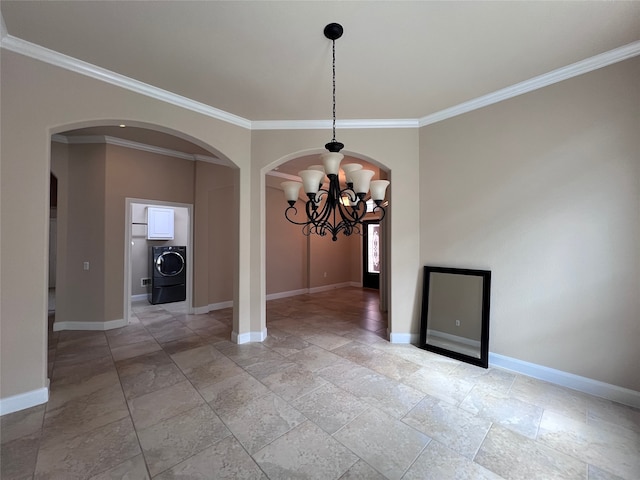 unfurnished dining area featuring crown molding, washer / dryer, and a notable chandelier