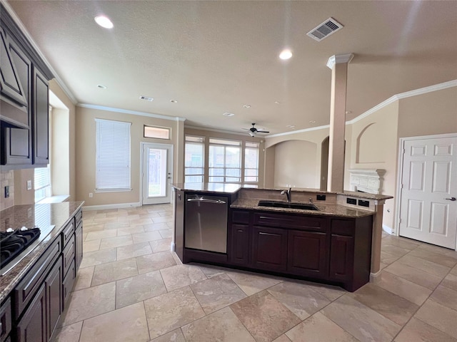 kitchen with sink, crown molding, stainless steel dishwasher, and a center island with sink