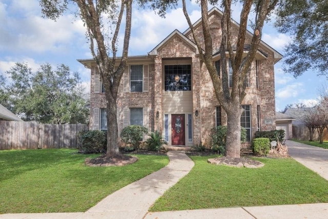 view of front of property with a garage and a front yard