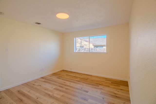 unfurnished room featuring light hardwood / wood-style flooring