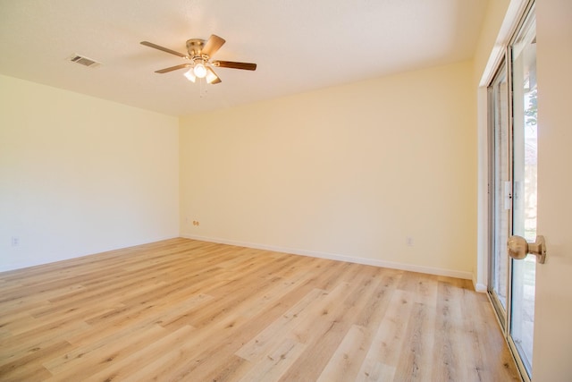 spare room featuring ceiling fan and light hardwood / wood-style flooring