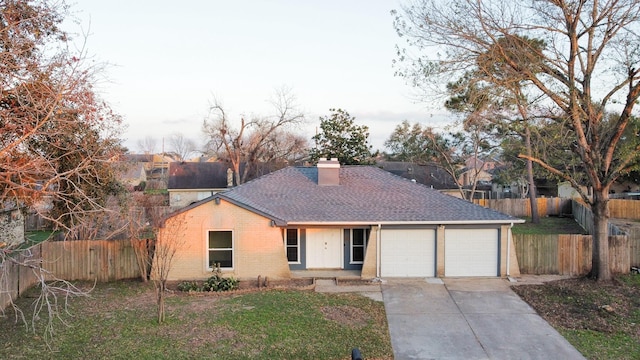 single story home with a garage