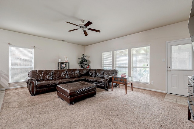 living room featuring light carpet and ceiling fan