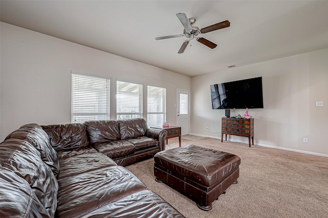 carpeted living room featuring ceiling fan