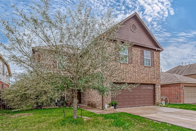 view of front of property featuring a garage and a front yard