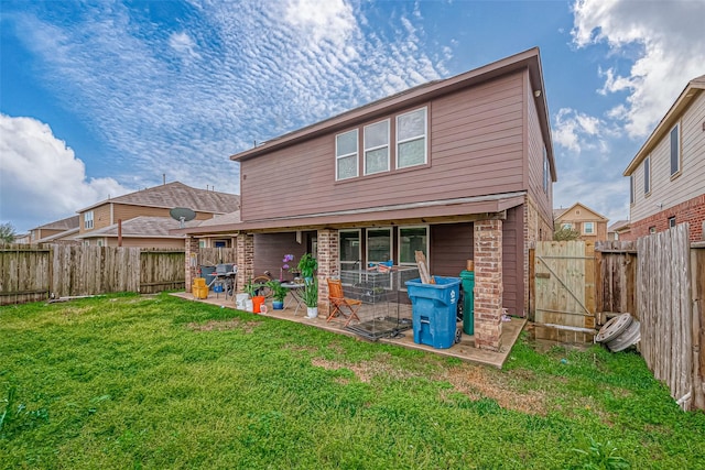 back of property featuring a lawn and a patio