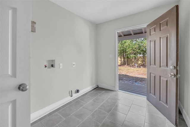 laundry area featuring light tile patterned floors, hookup for a gas dryer, hookup for a washing machine, and electric dryer hookup