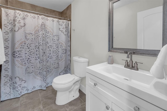 bathroom with tile patterned floors, vanity, and toilet