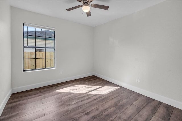 empty room featuring hardwood / wood-style flooring and ceiling fan