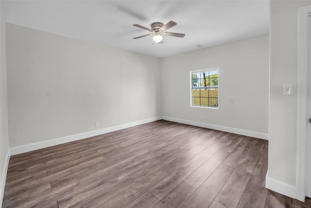 empty room featuring ceiling fan and wood-type flooring