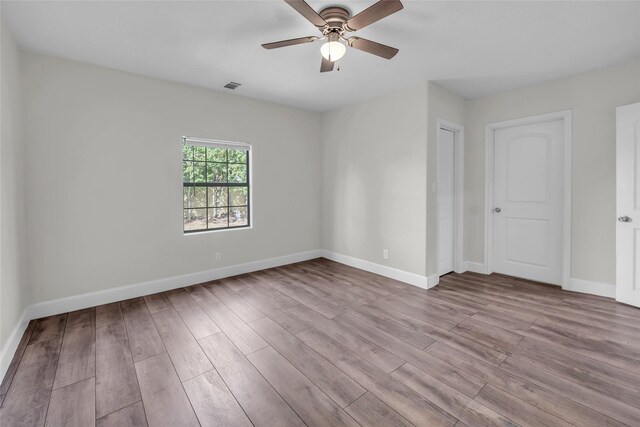 unfurnished room featuring ceiling fan and light hardwood / wood-style flooring