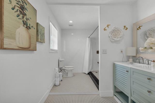 bathroom featuring vanity, toilet, and a shower with curtain