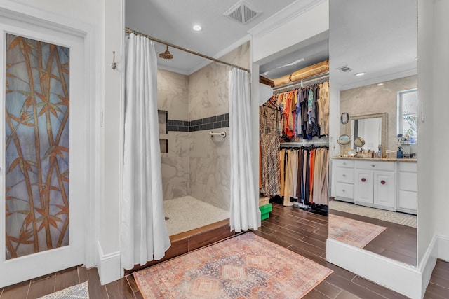 bathroom with ornamental molding, vanity, and a shower with curtain