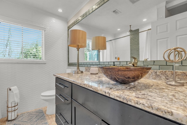 bathroom with vanity, curtained shower, tile patterned floors, and toilet