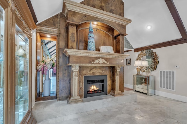 unfurnished living room with vaulted ceiling, ornamental molding, and a premium fireplace