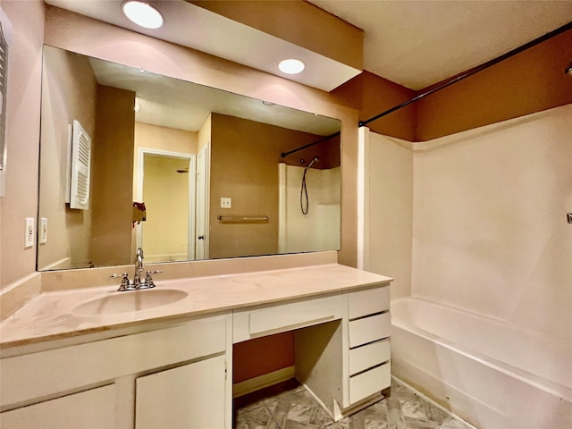 bathroom with vanity and bathtub / shower combination