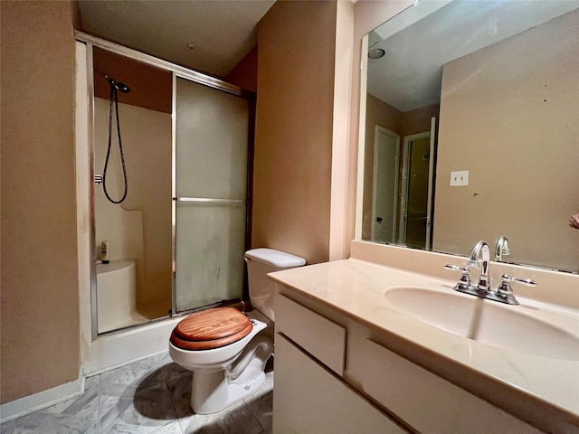 bathroom featuring vanity, toilet, and walk in shower