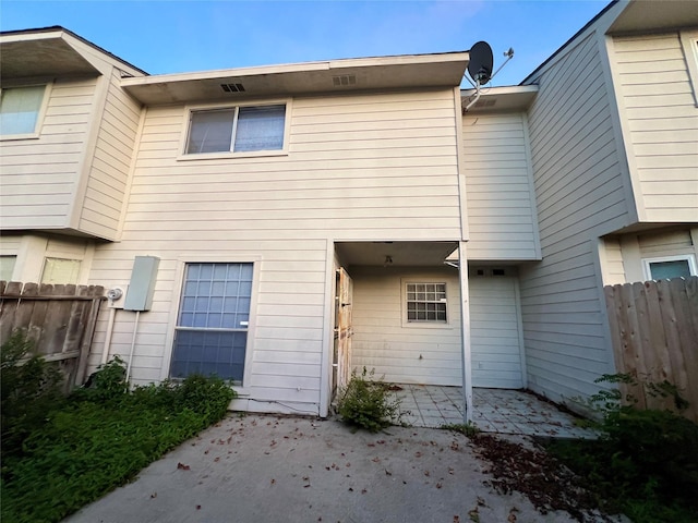 back of property featuring a patio area