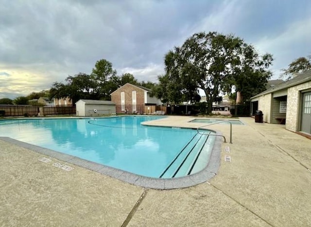 view of swimming pool featuring a patio area