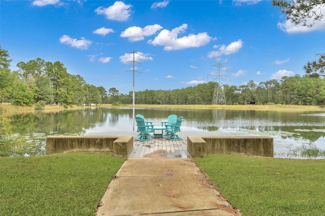 dock area with a water view and a lawn