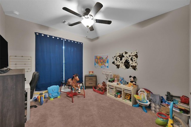 playroom with carpet floors and ceiling fan