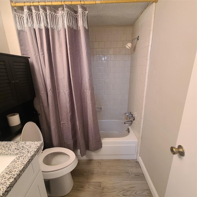 full bathroom with vanity, toilet, shower / bath combination with curtain, and a textured ceiling