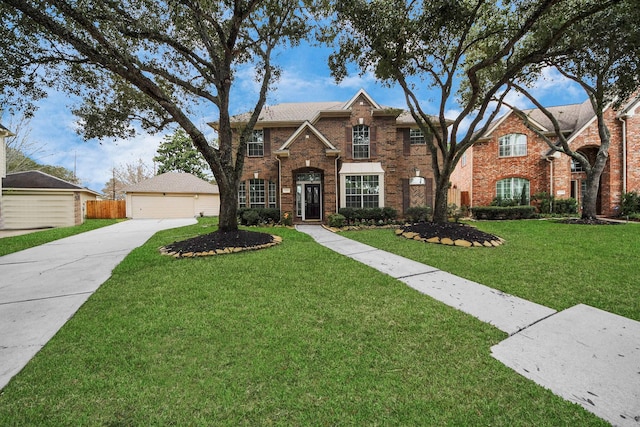 view of front of house with a garage and a front yard