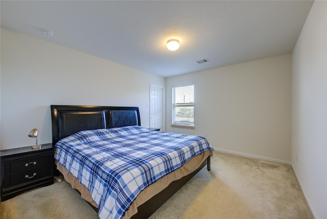 bedroom with light carpet