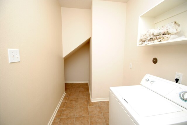 washroom featuring washer / clothes dryer and light tile patterned floors