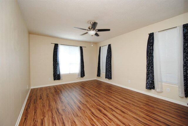 unfurnished room featuring ceiling fan and wood-type flooring