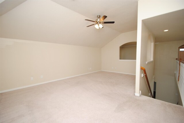 bonus room featuring lofted ceiling, light colored carpet, and ceiling fan