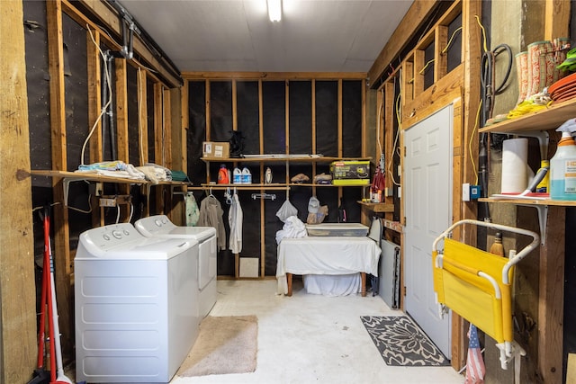 storage area featuring washing machine and dryer