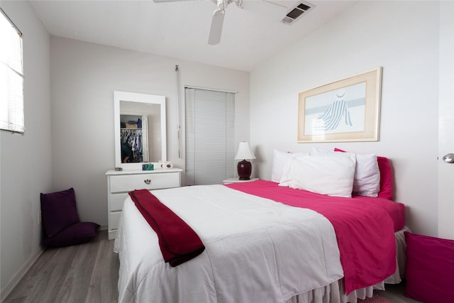 bedroom featuring hardwood / wood-style flooring and ceiling fan