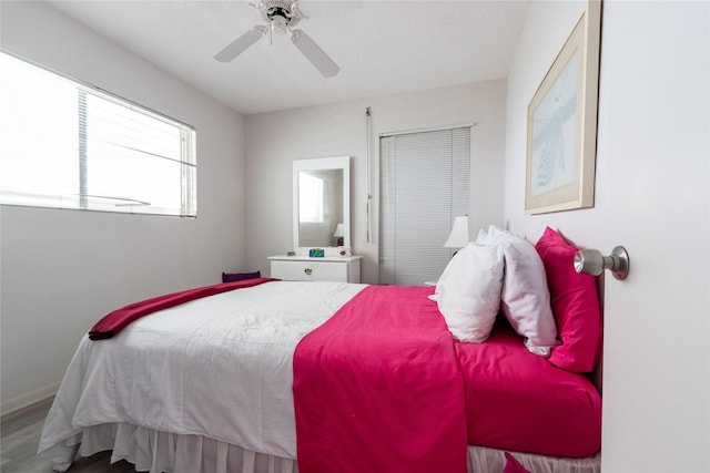 bedroom featuring hardwood / wood-style flooring and ceiling fan