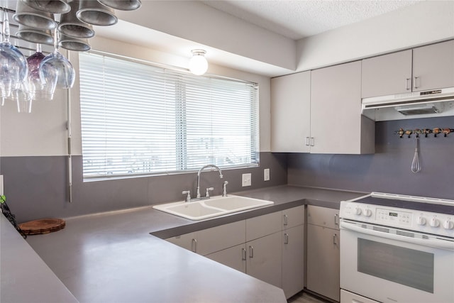 kitchen featuring backsplash, sink, a textured ceiling, and white range with electric stovetop