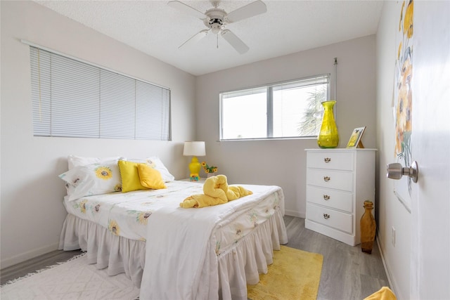 bedroom featuring ceiling fan and light wood-type flooring