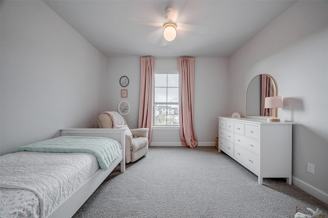 bedroom featuring baseboards, a ceiling fan, and light colored carpet