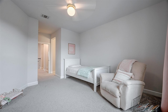 bedroom with light colored carpet, visible vents, ceiling fan, and baseboards