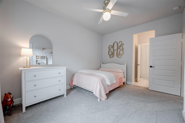 bedroom with a ceiling fan and light colored carpet