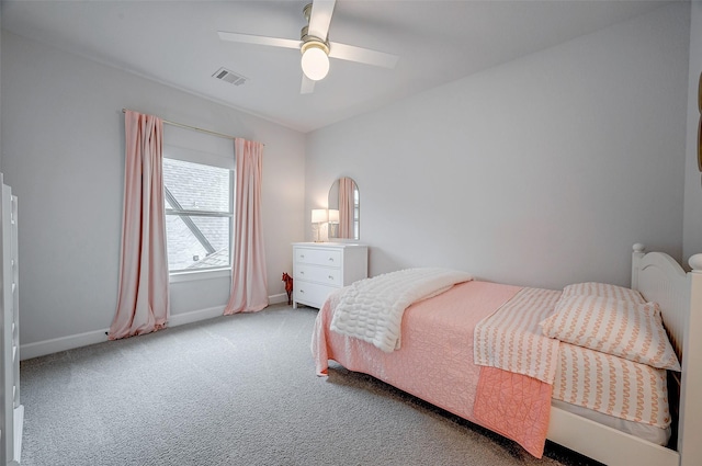 bedroom featuring a ceiling fan, visible vents, light carpet, and baseboards