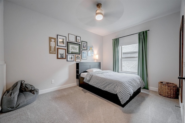 bedroom featuring ceiling fan, baseboards, and light colored carpet