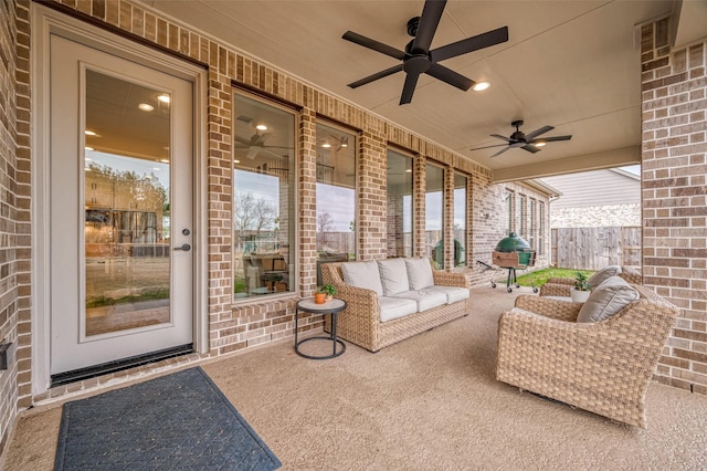 view of patio with outdoor lounge area, ceiling fan, and fence