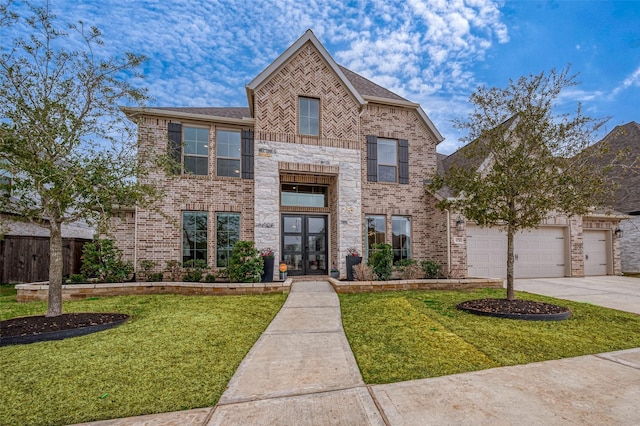 view of front of house featuring driveway, brick siding, a front lawn, and french doors